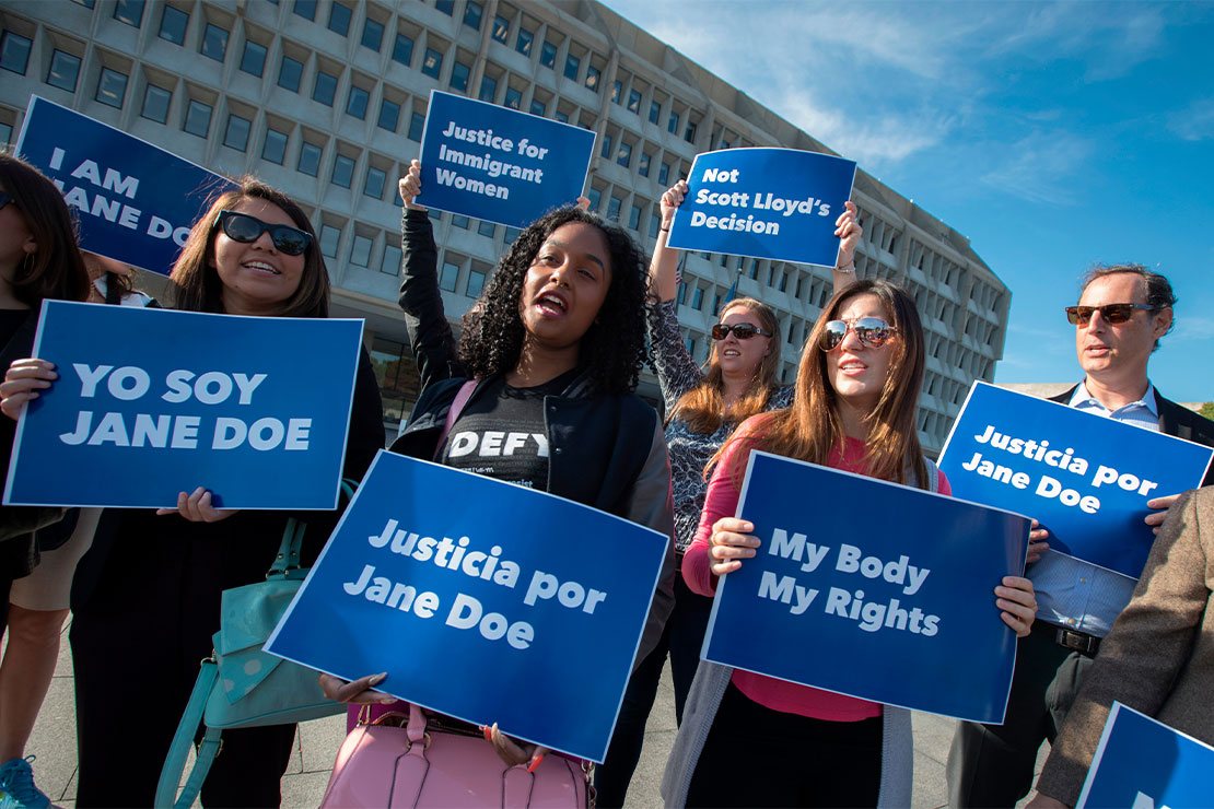 Activists carrying signs that read "Justicia por Jane Doe, Yo Soy Jane Doe, Justice for Immigrant Women and My Body My Rights," gathered to protest the government interfering with the ability of pregnant immigrant teens to obtain abortions.