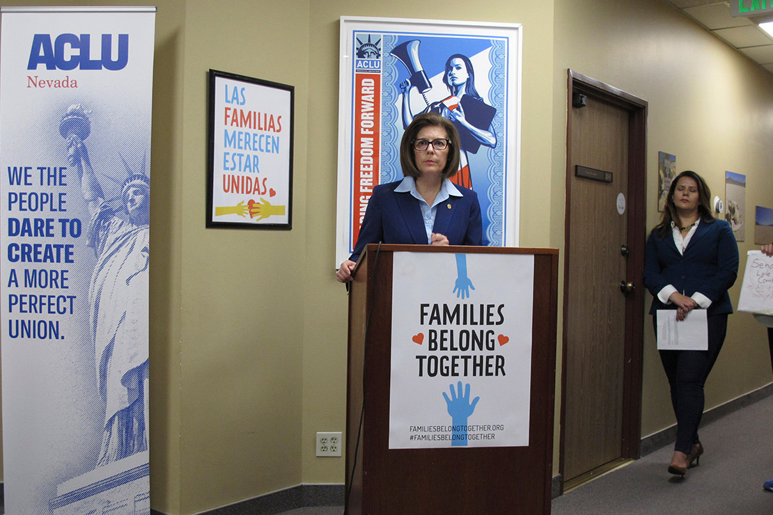 Senator Catherine Cortez Masto, speaks at a news conference condemning the Trump administration's immigration policy as ACLU of Nevada Policy Director Holly Welborn looks on.