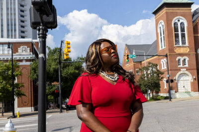 Khadidah Stone stands on the dividing line between her old Alabama congressional District 7, to her right with River City Church, and her new district, District 2, to her left, in downtown Montgomery, Ala., Sept. 20, 2022. The Supreme Court’s decision last June siding with Black voters on a redistricting case in Alabama gave Democrats and voting rights activists a surprise opportunity ahead of the 2024 elections to have congressional maps redrawn in a handful of states. Fast forward three months and maps in Alabama and other states that could produce more districts represented by Black lawmakers still don’t exist.