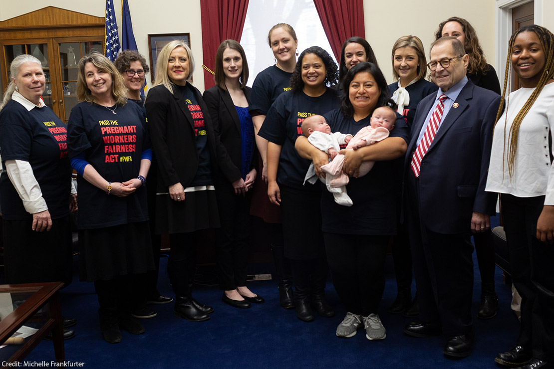 A group of women wearing t shirts saying Pass the Pregnant Workers Fairness Act.