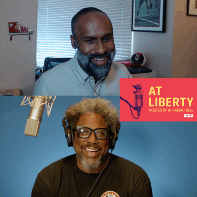 Picture of podcast host W. Kamau Bell interviewing a guest